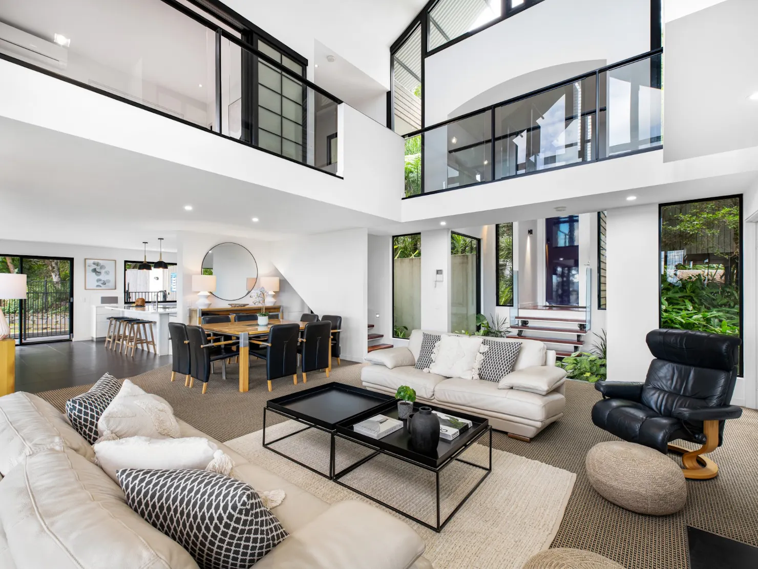 Open plan living and dining with balcony access