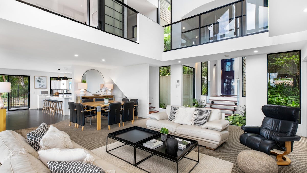 Open plan living and dining with balcony access