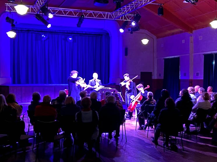 Five classical musicians performing at the Malachi Gilmore Hall, Oberon NSW