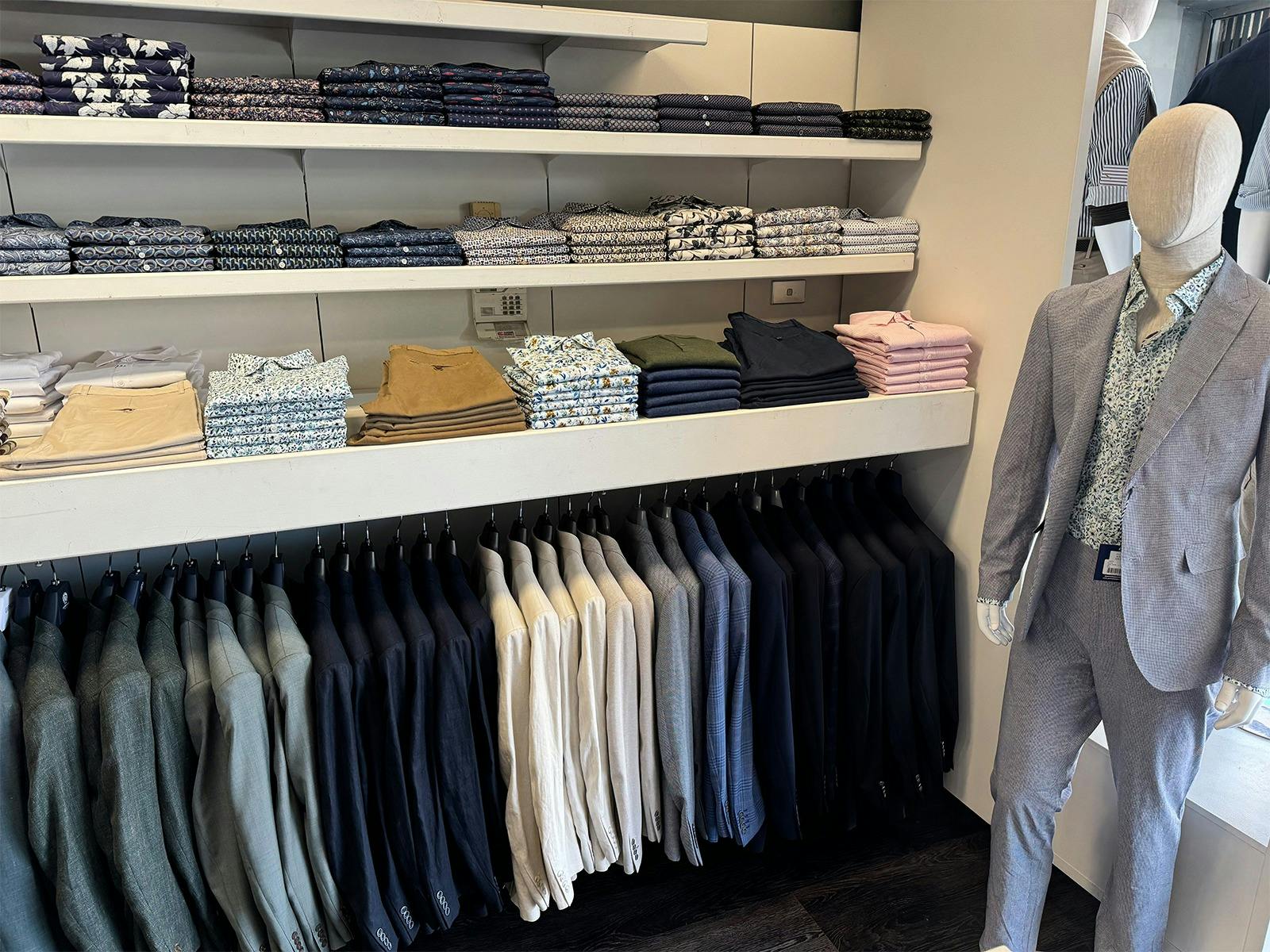 Inside view of shelves and rack at Hartfords Menswear