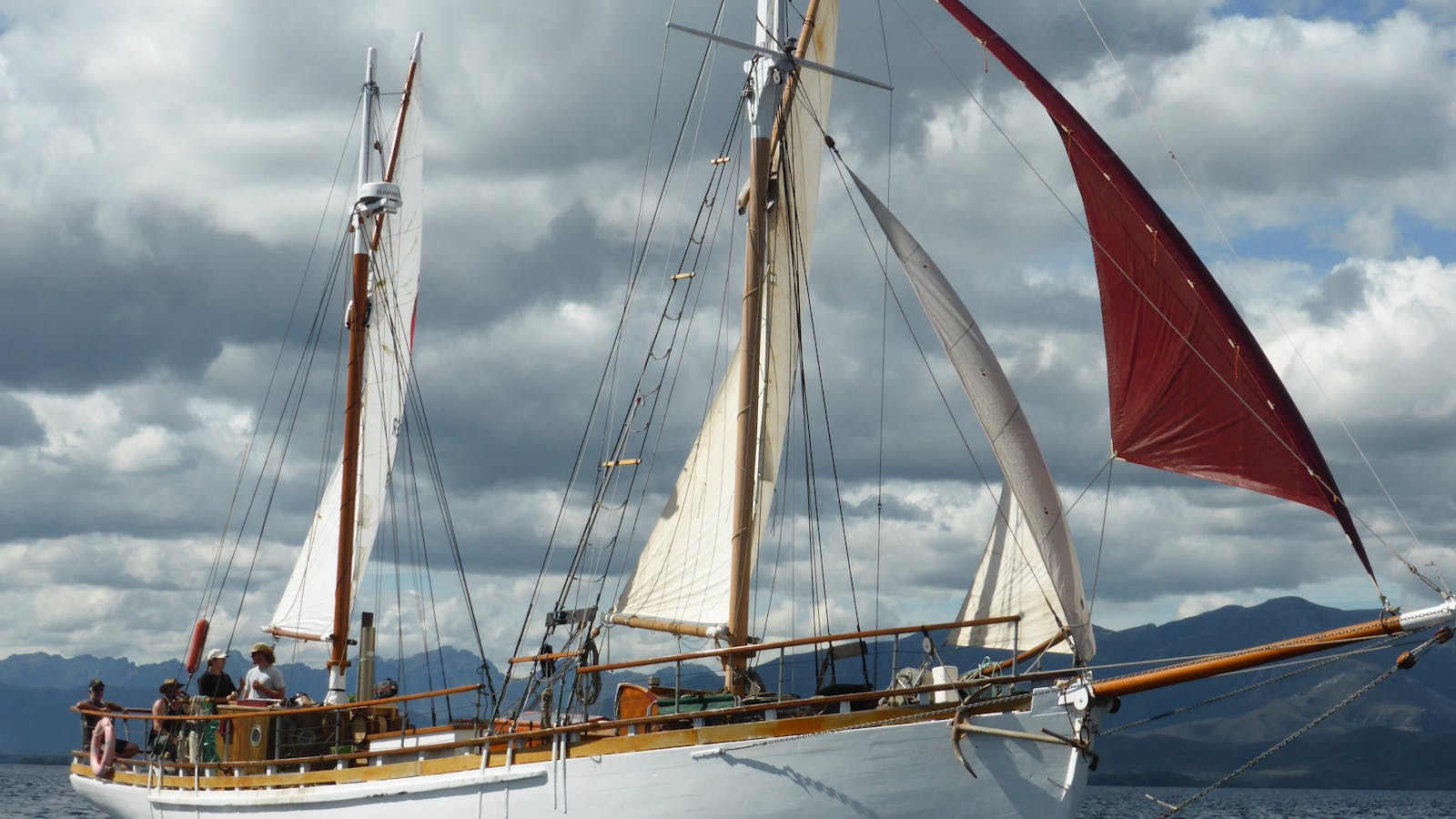 Kerrawyn under full at Port Davey on the West Coast of Tasmania during our circumnavigation in 2021