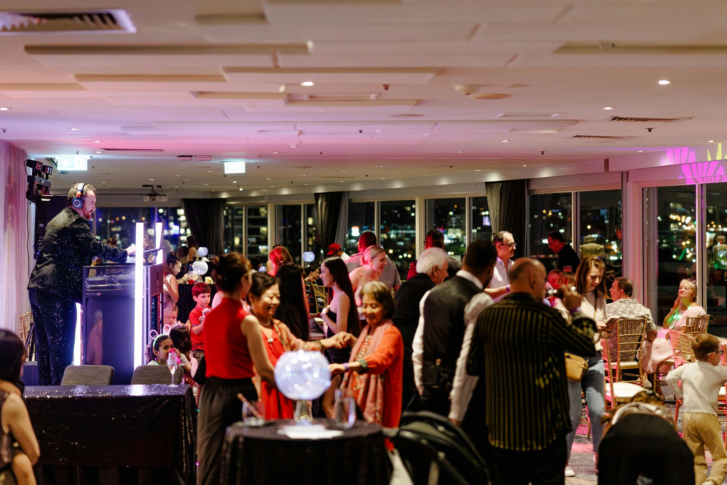 Guests enjoying a festive rooftop event at Rydges South Bank Brisbane