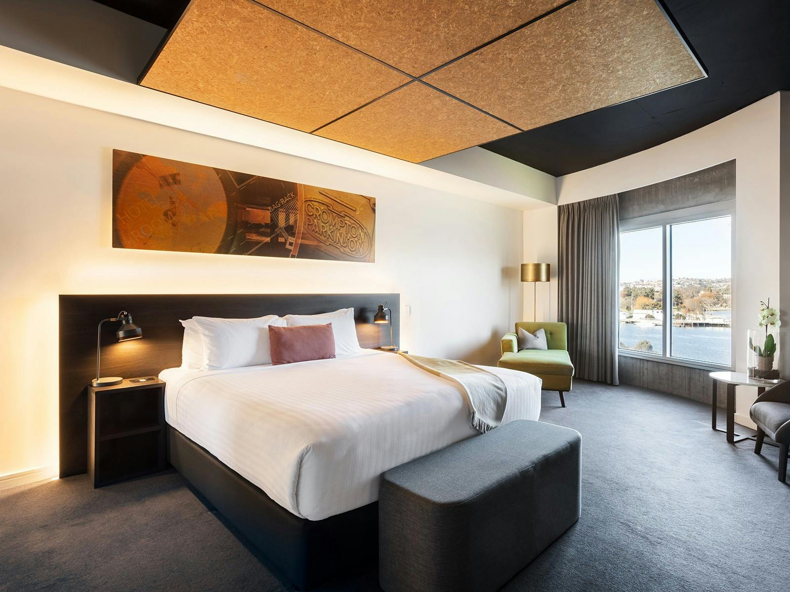 Interior of hotel accommodation room showing river views out the window,