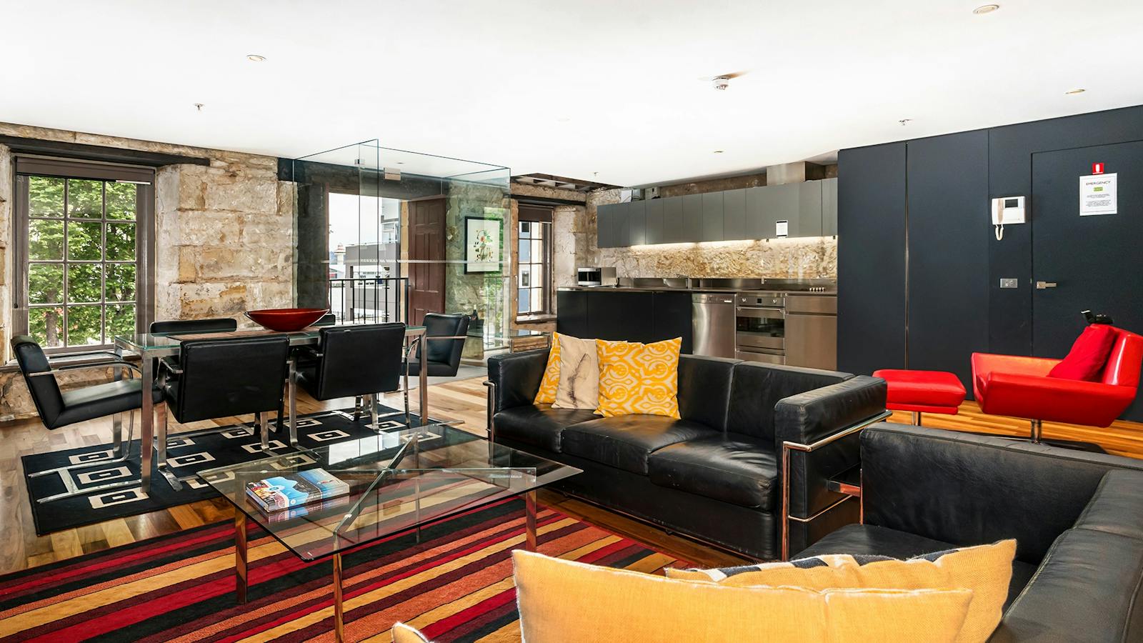 Large light filled modern apartment in a historic sandstone Salamanca Place building.