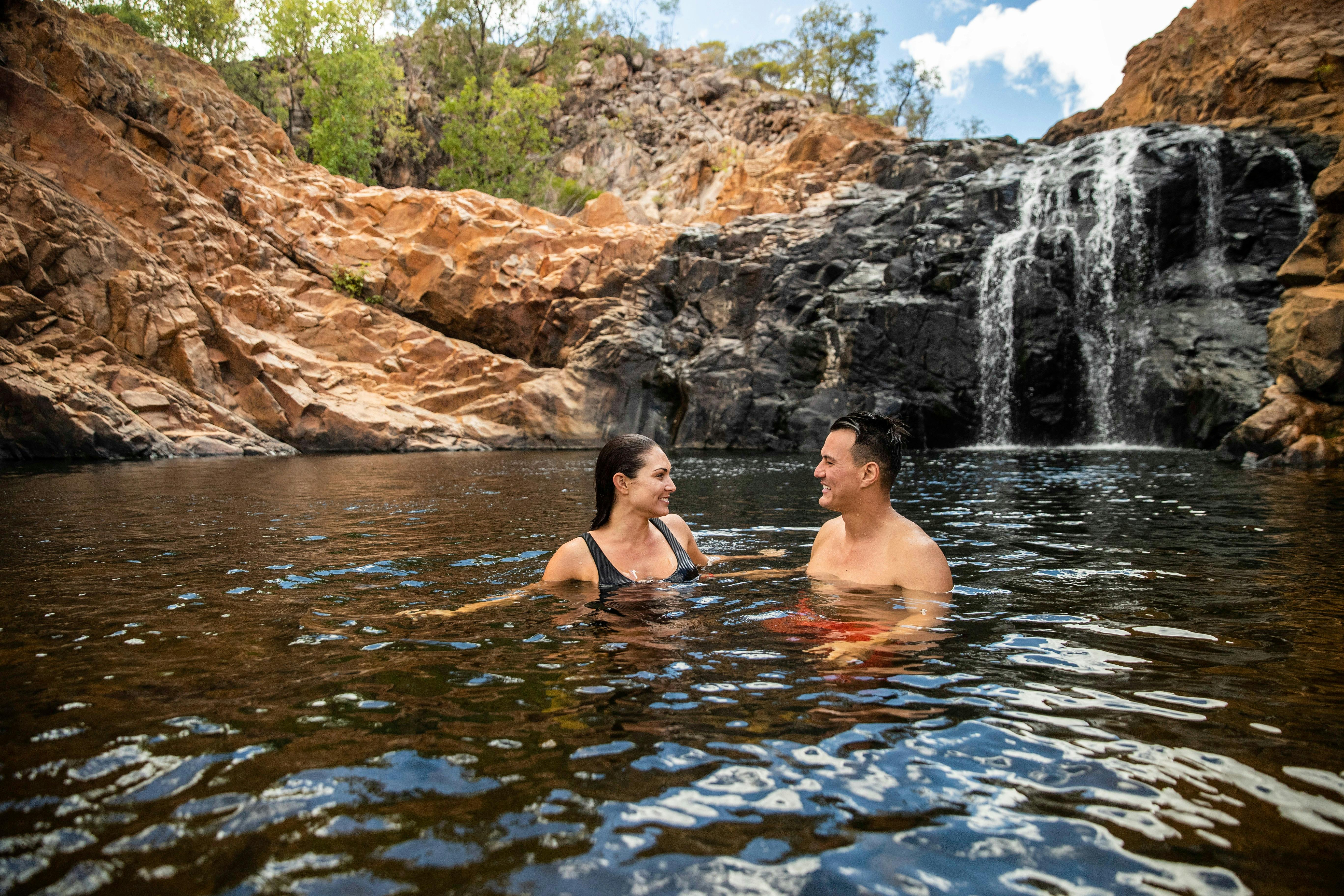 Couple swimming in Leliyn/Edith Falls