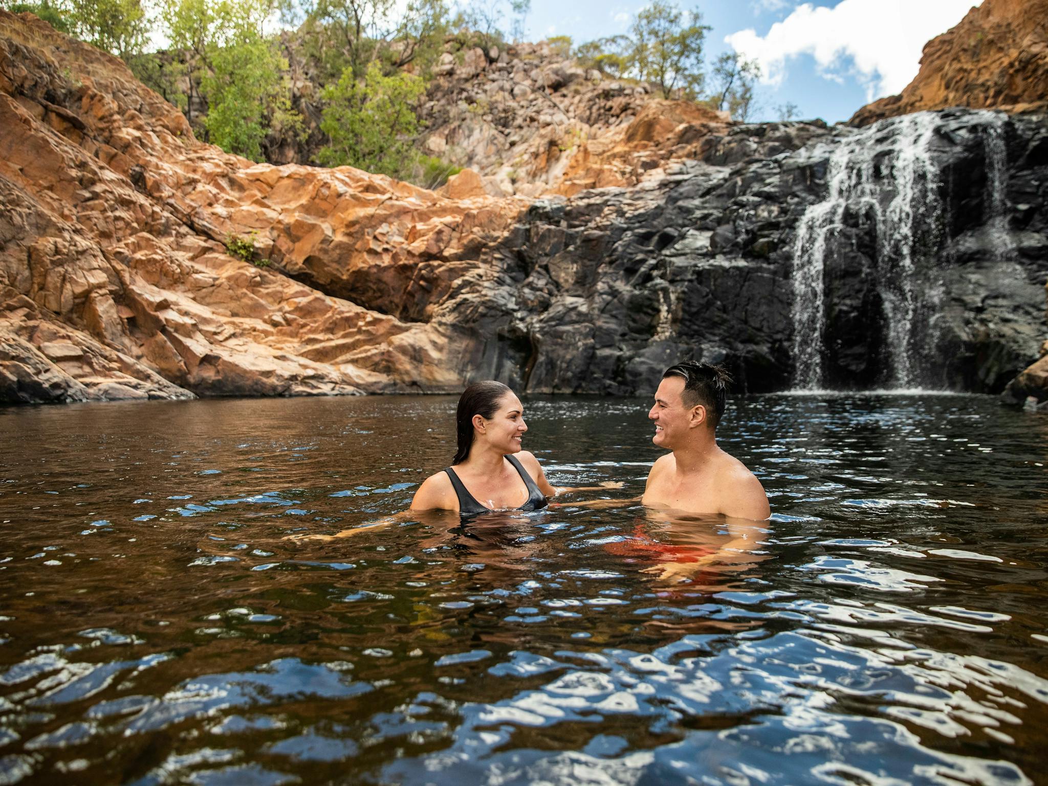 Couple swimming in Leliyn/Edith Falls