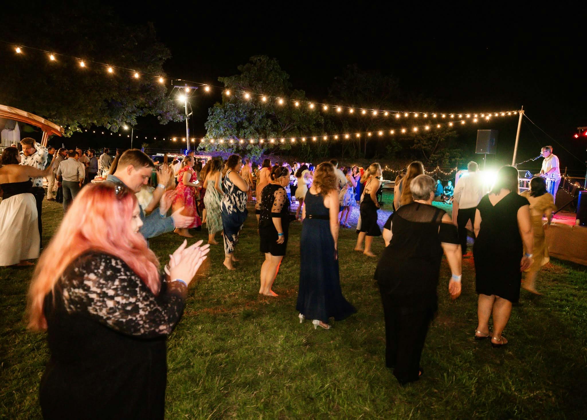Image of attendees dancing at the event