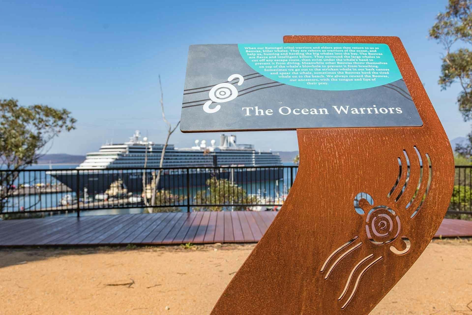 Close up of beautiful interpretive sign with cruise ship in backgroun