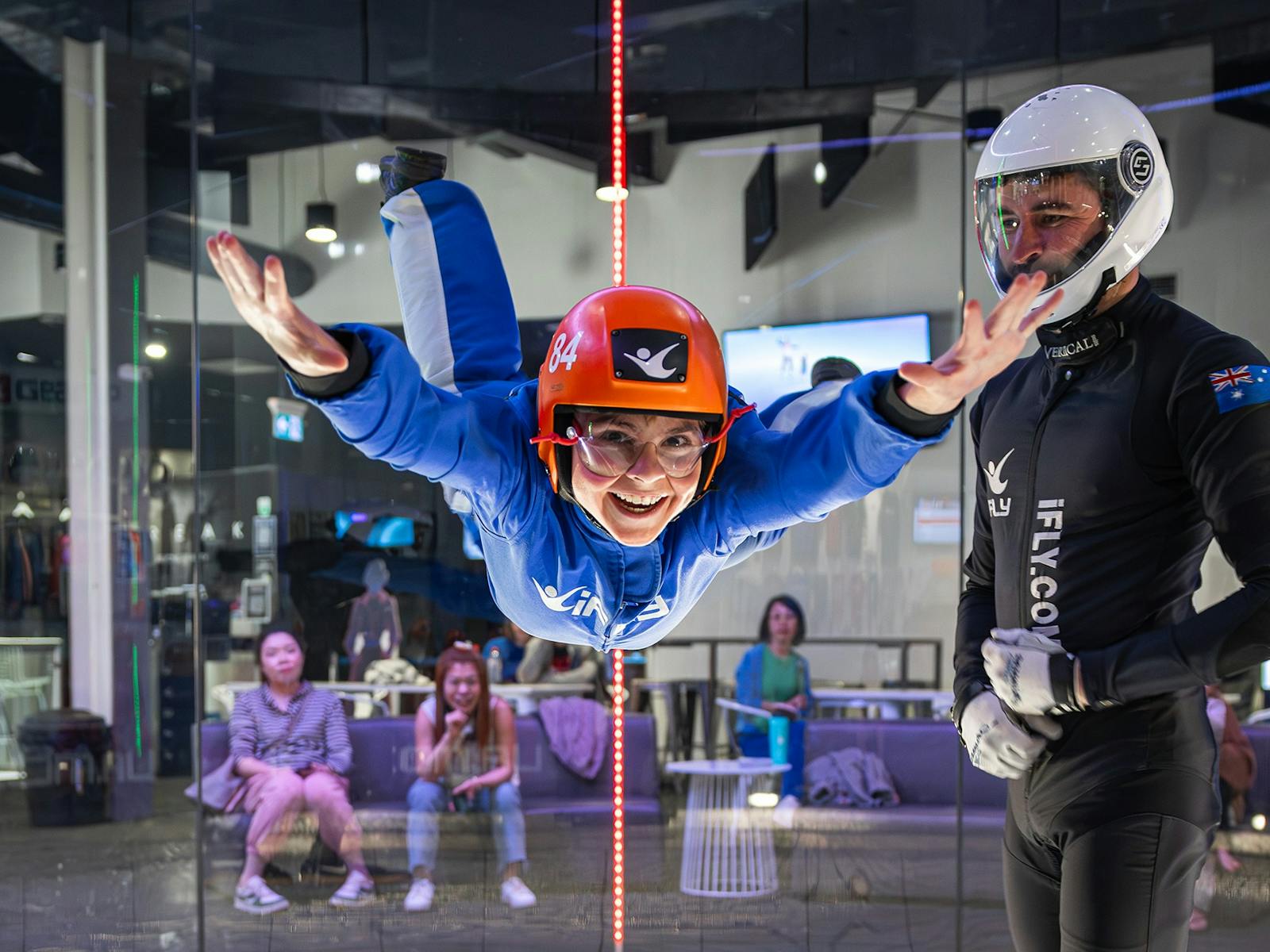 Young kid smiles while flying