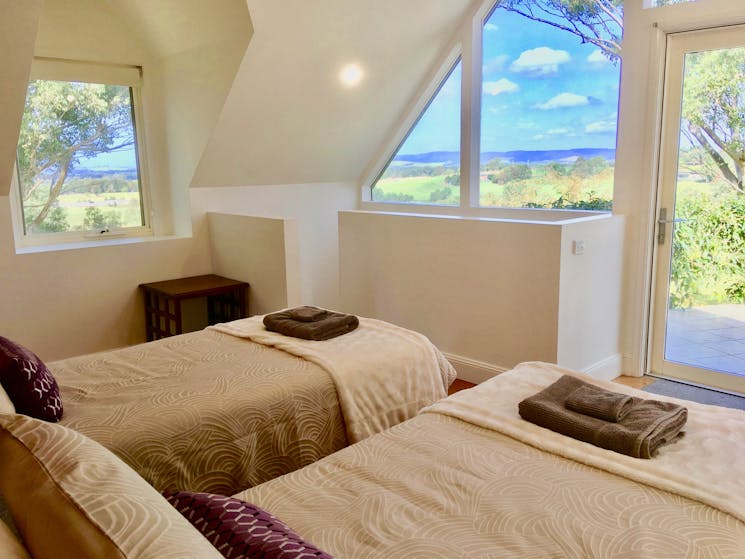 Bedroom with cathedral windows and great views. Can be set as king or twin singles