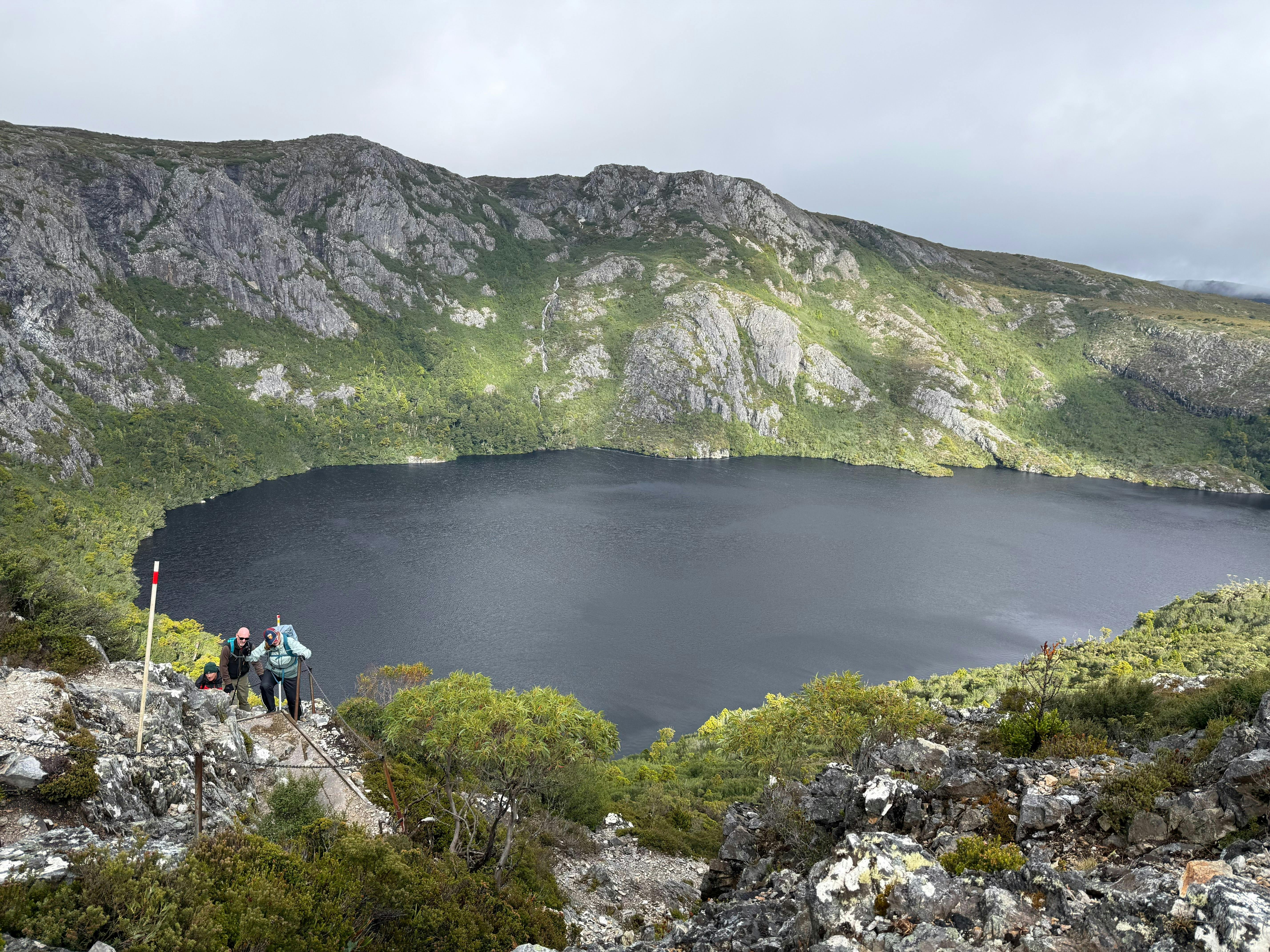 View of alpine lake surrounded by mountains in Walls of Jerusalem Tasmania.