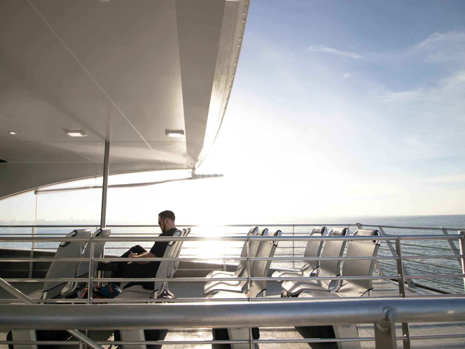 A passenger enjoying the back deck onboard Port Phillip Ferries