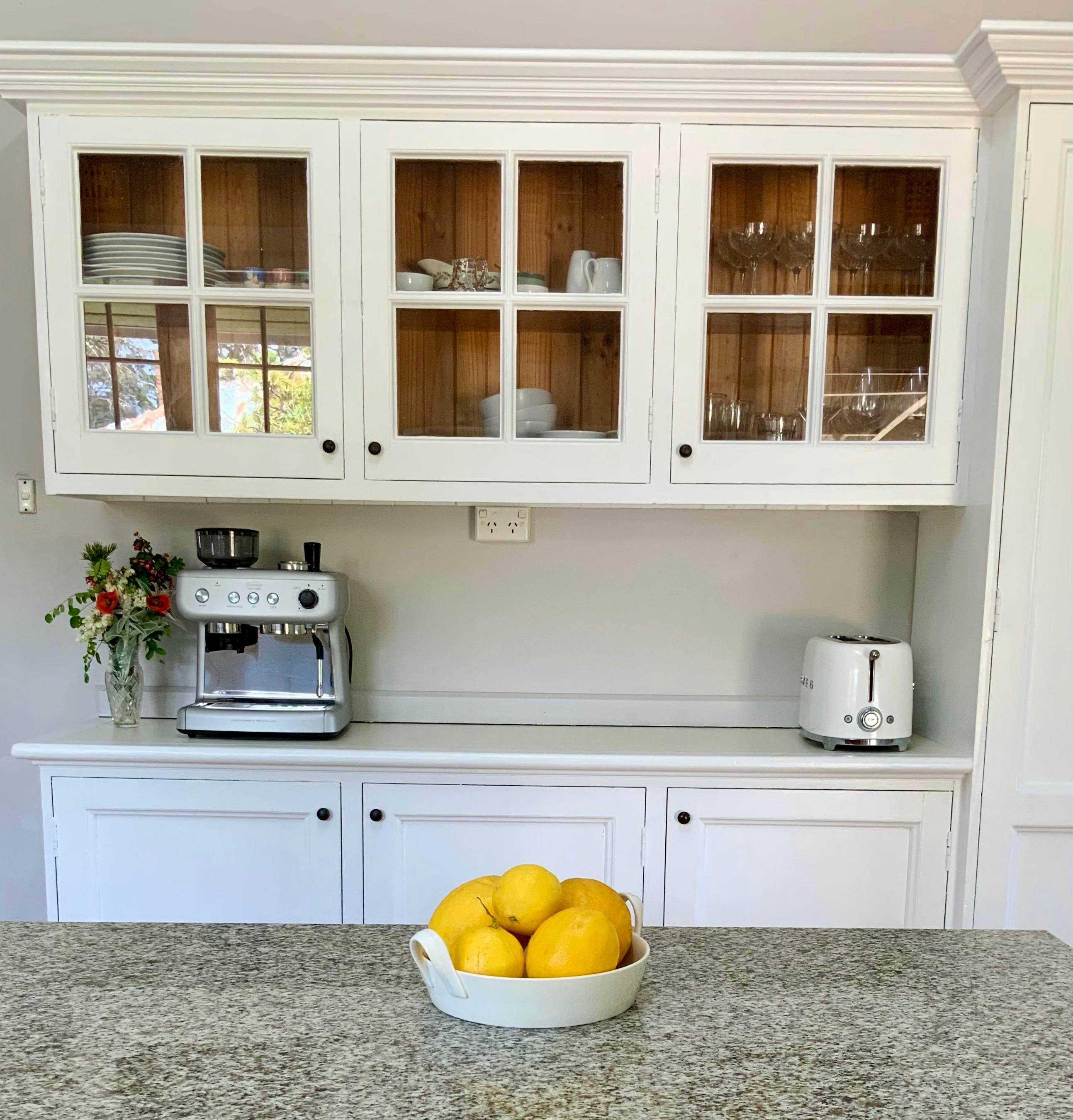 This light and spacious kitchen is ideal for cooking and meal prep with a central island bench