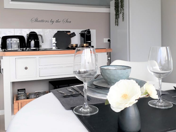 Kitchenette and dining area at Shutters by the Sea in Kiama