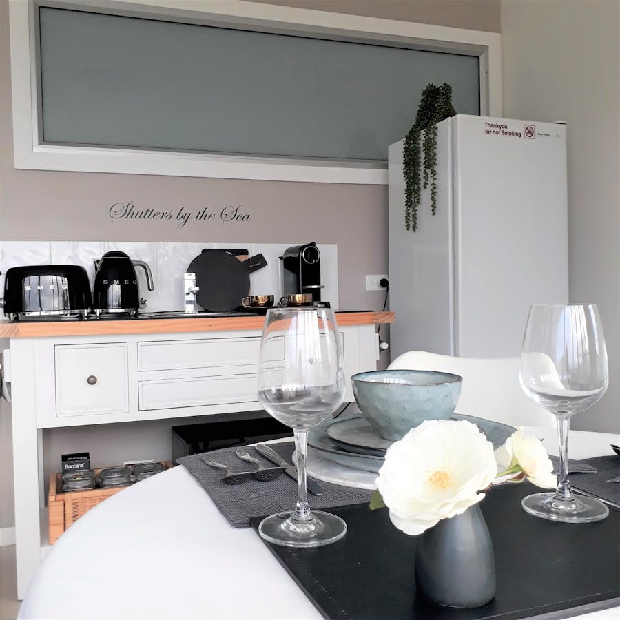 Kitchenette and dining area at Shutters by the Sea in Kiama