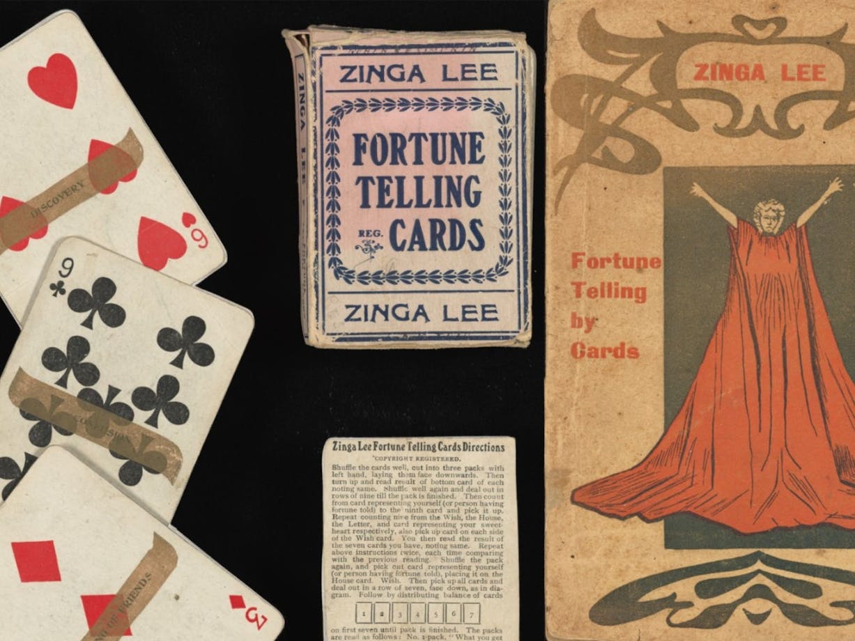 Playing cards pictured alongside their packaging