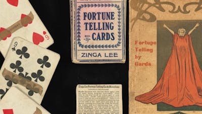 Playing cards pictured alongside their packaging