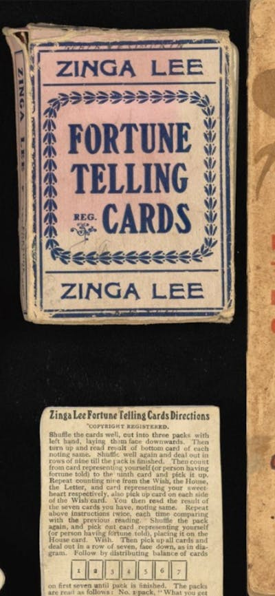 Playing cards pictured alongside their packaging