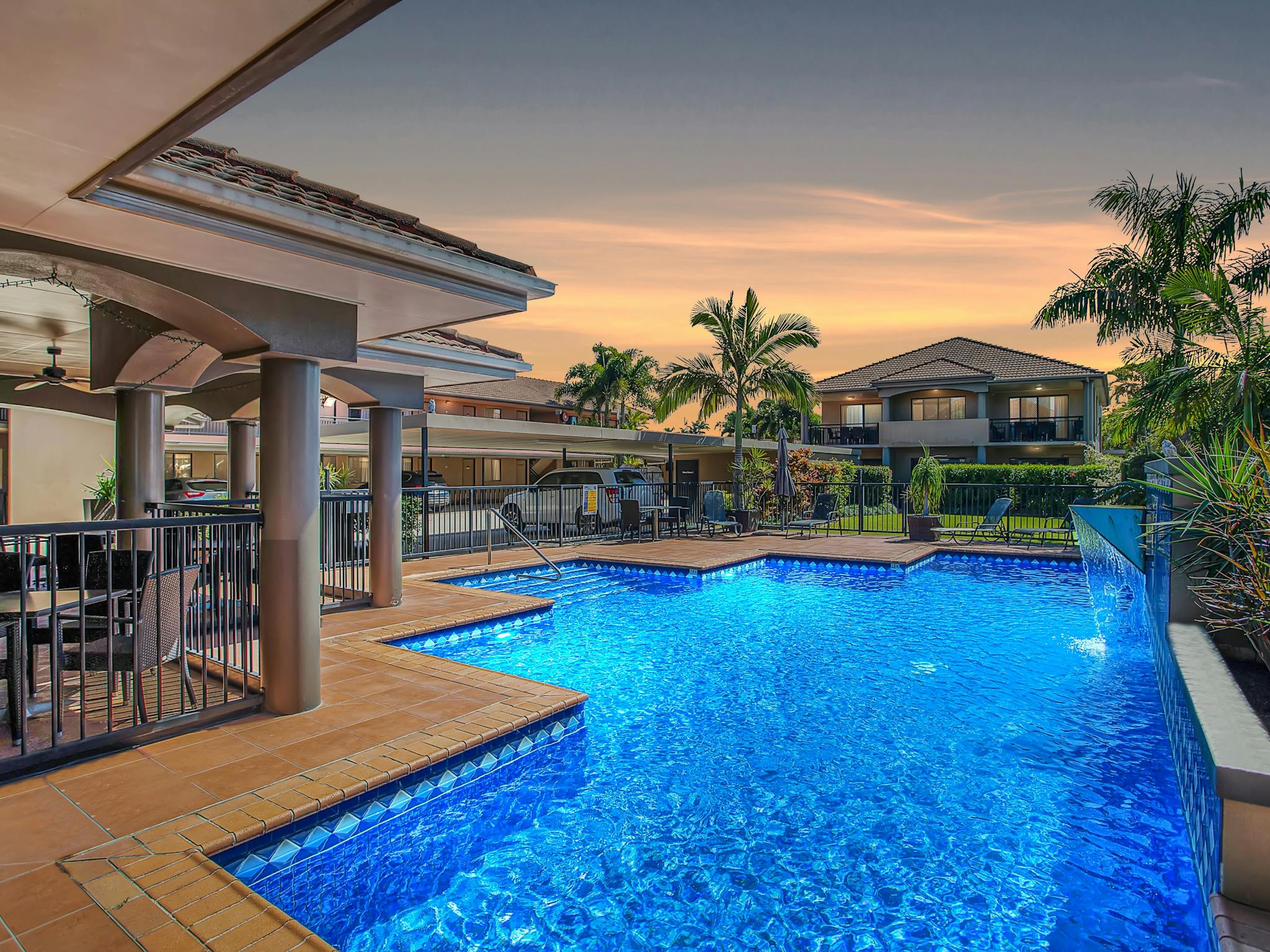 Resort style swimming pool with alfresco dining area Resort style swimming pool with alfresco dining area