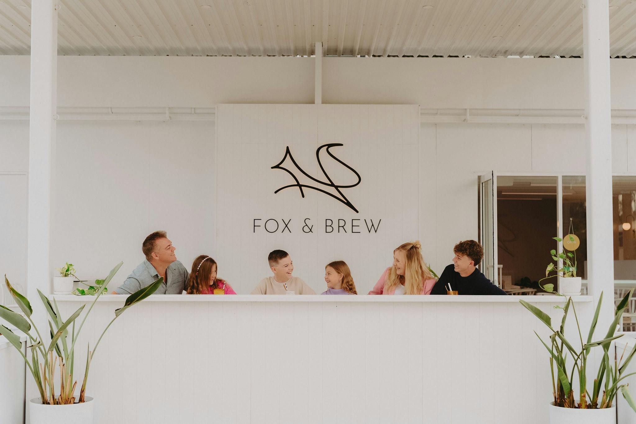 Family of 6 sitting outside the Fox and Brew