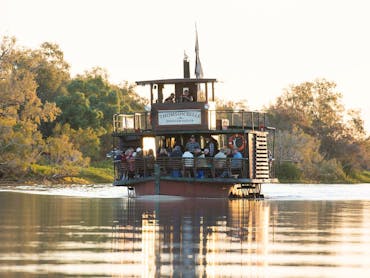 Heritage paddlewheeler boat cruising on outback river in Longreach Heritage paddlewheeler boat cruising on outback river in Longreach