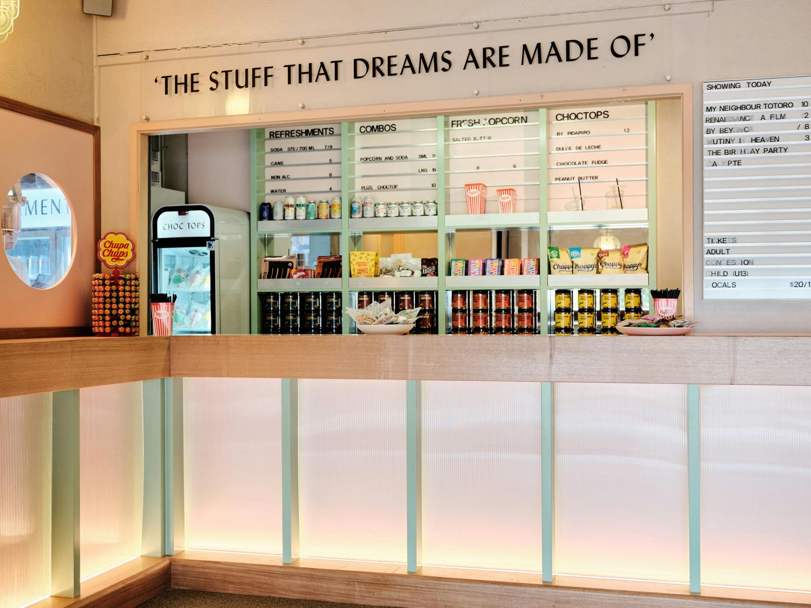 Brightly coloured candy bar with signage above saying "The stuff that dreams are made of"