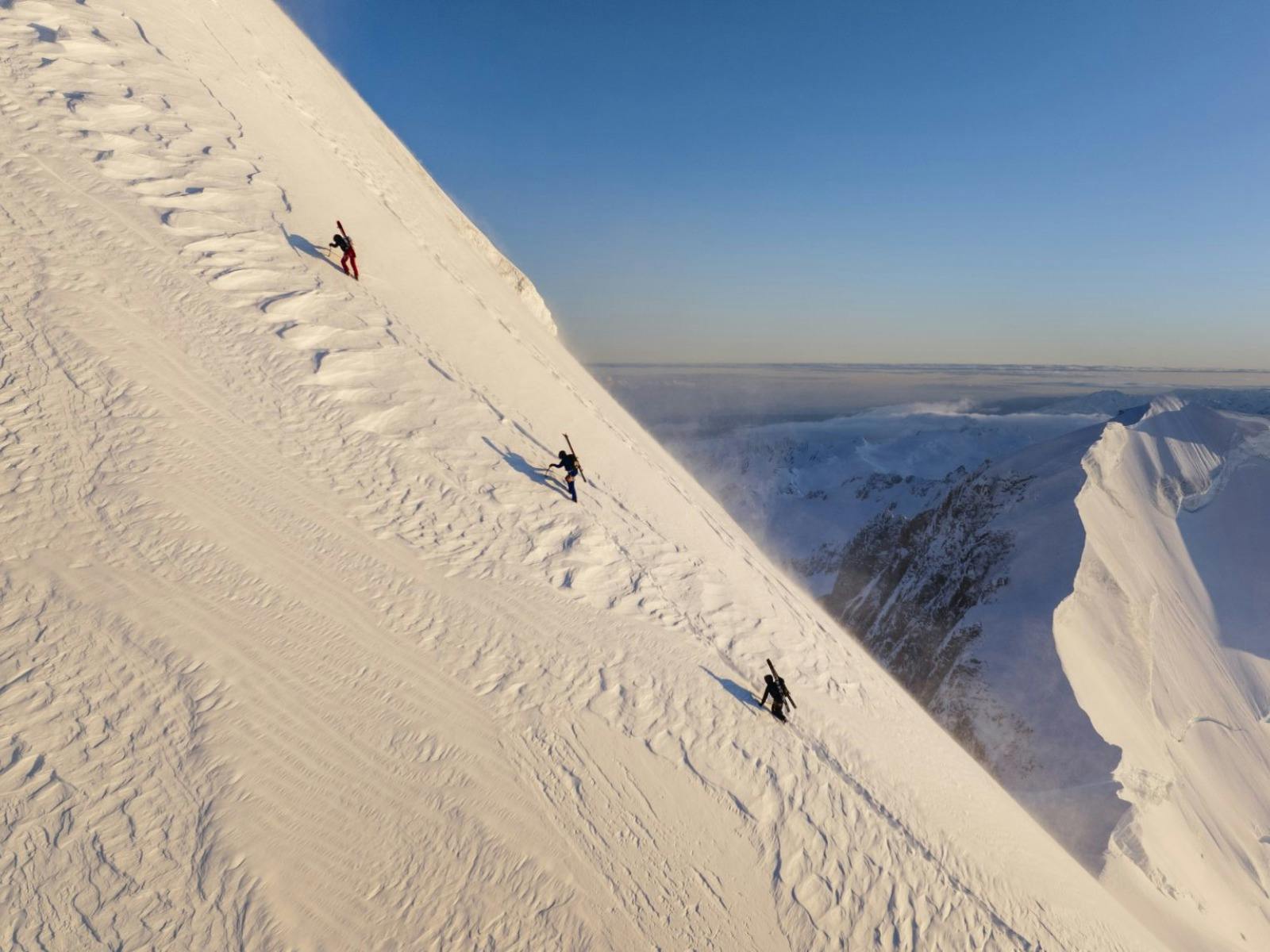 Wide shot of climbers up a snowy mountain