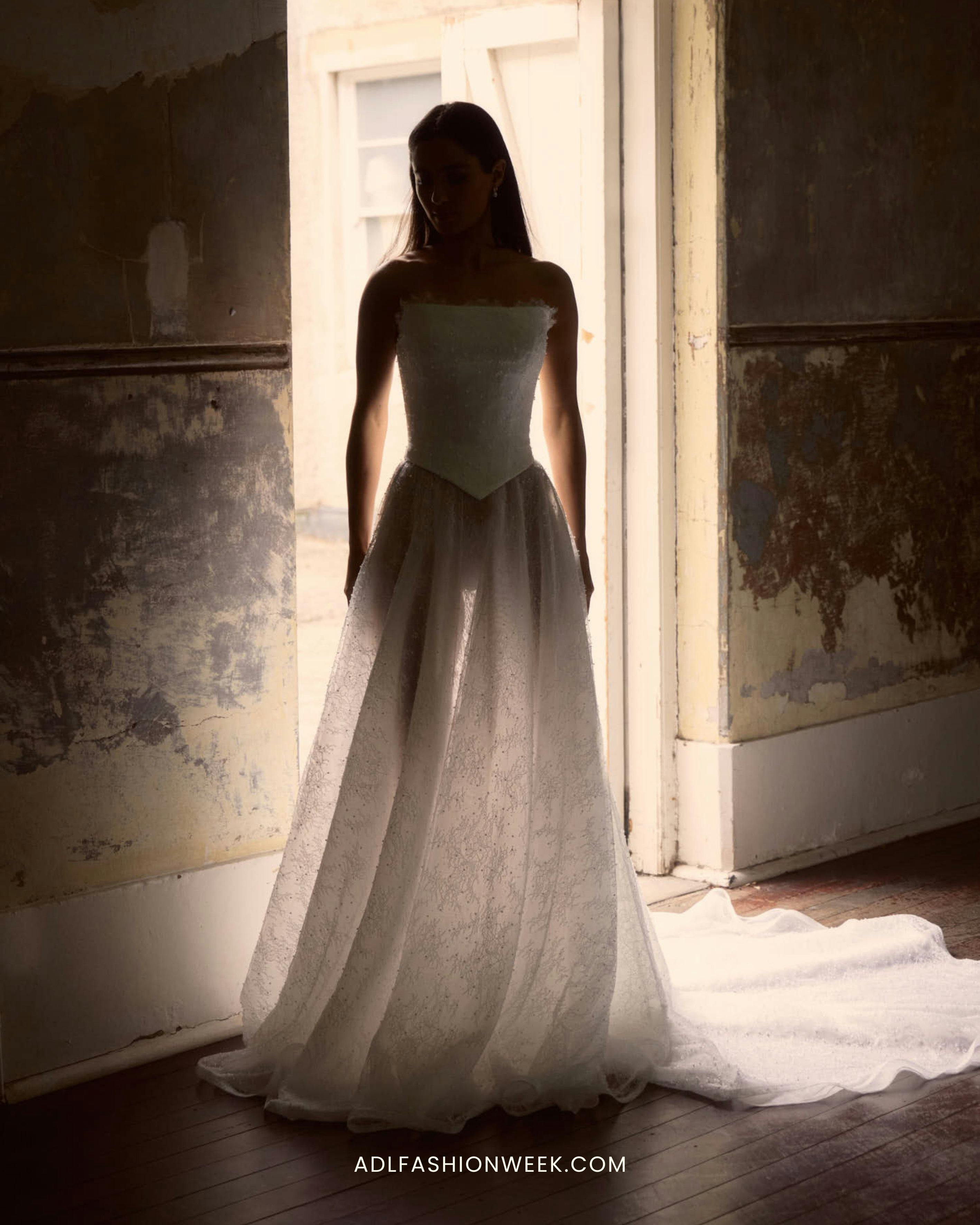 bride in anna campbell separates with light filtered through