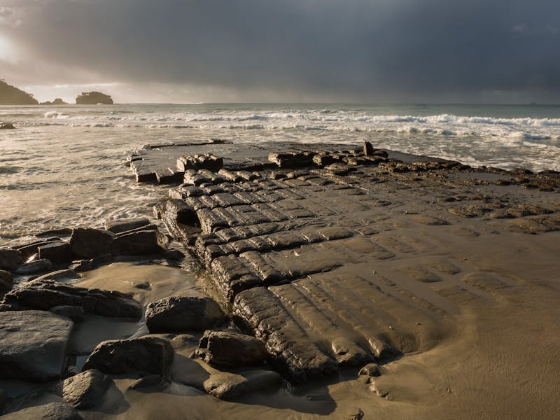 Tessellated pavement looking out to sea, morning sun shining from the top left