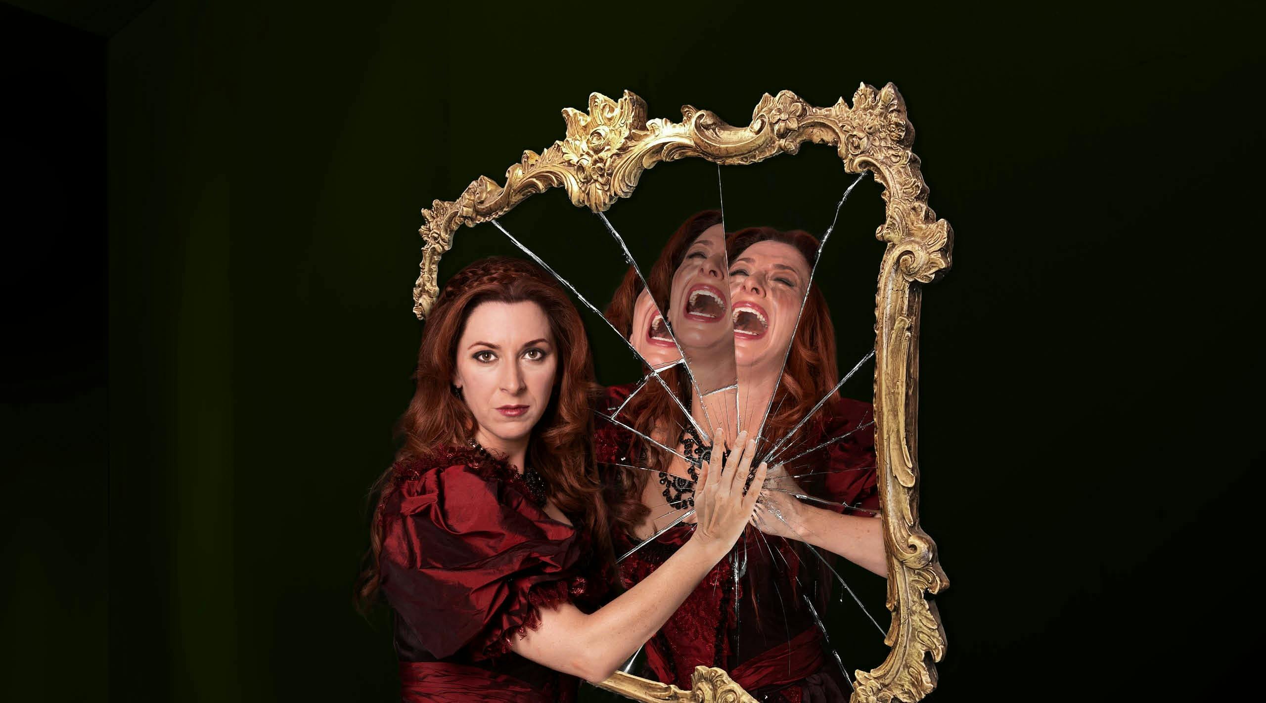 A woman standing in front of a smashed mirror