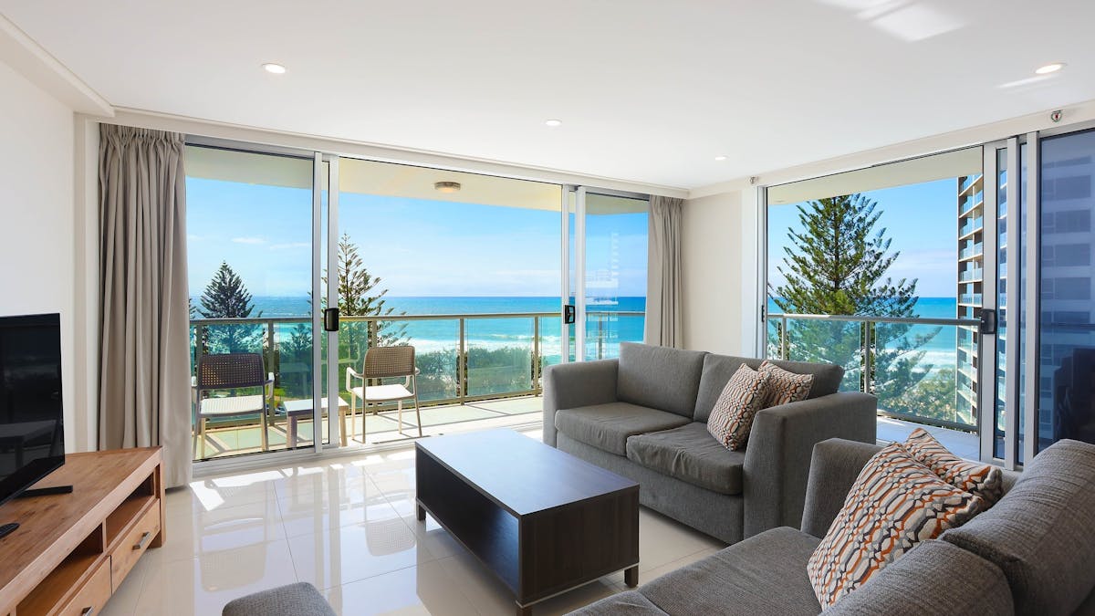 Lounge room with smart TV, Balcony wit direct ocean views Surfers Paradise Gold Coast Holidays