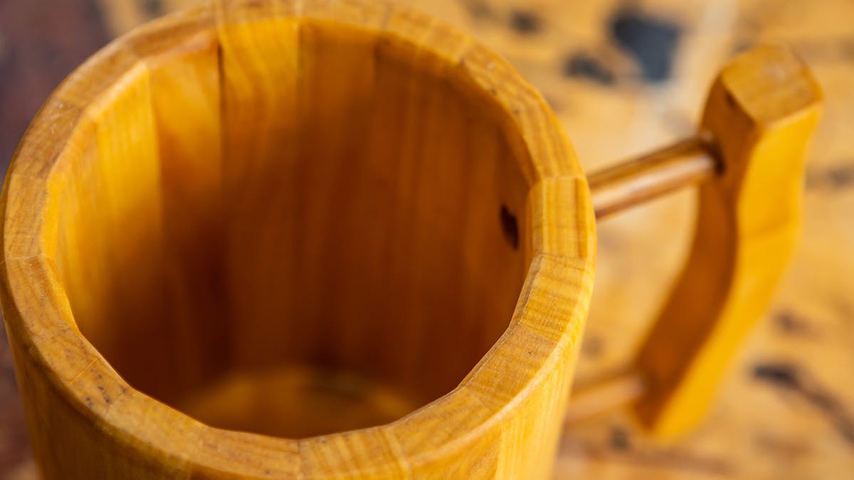 Close-up of wooden tankard looking down into the cup.
