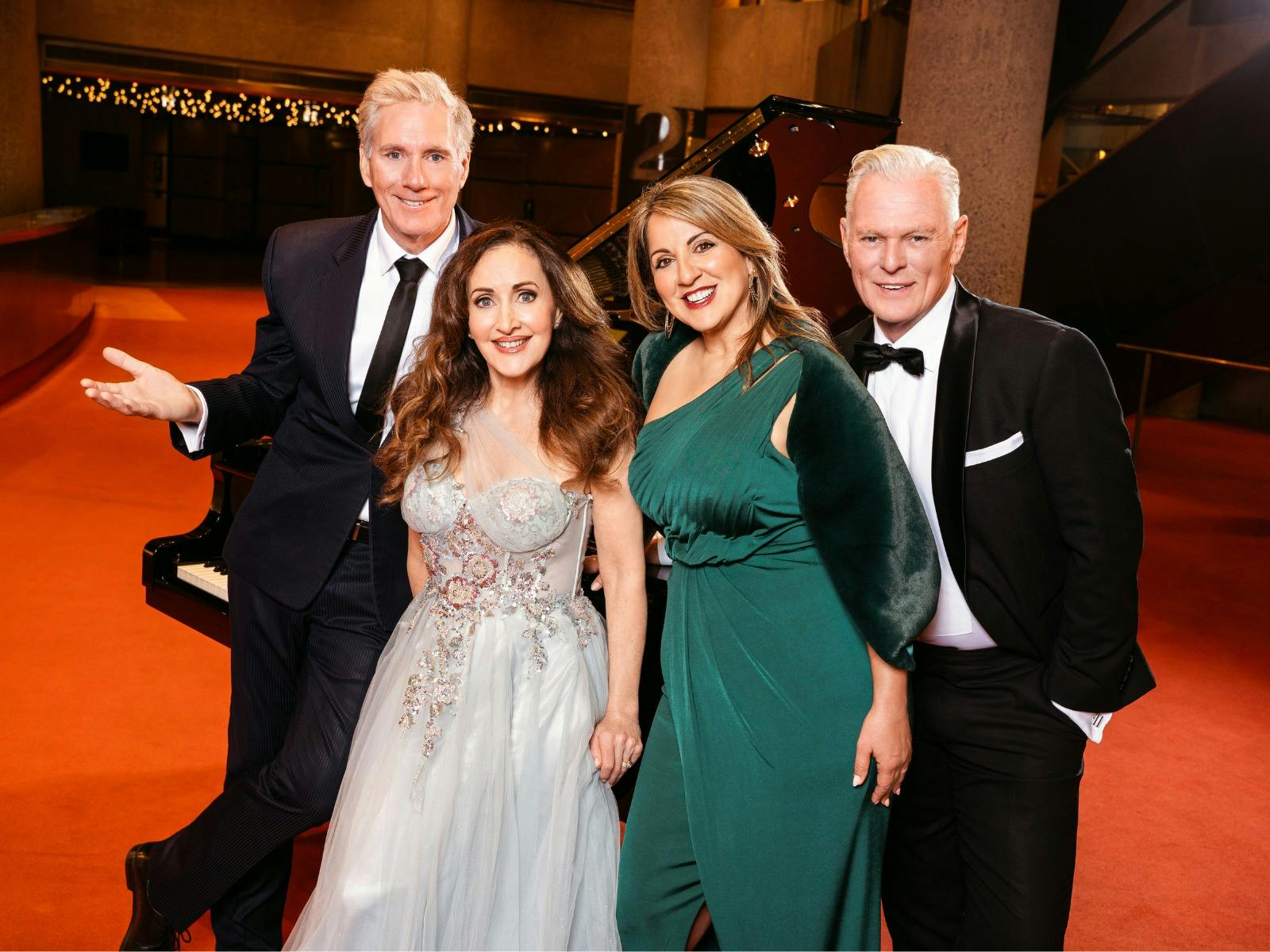 two man and two women on red carpet