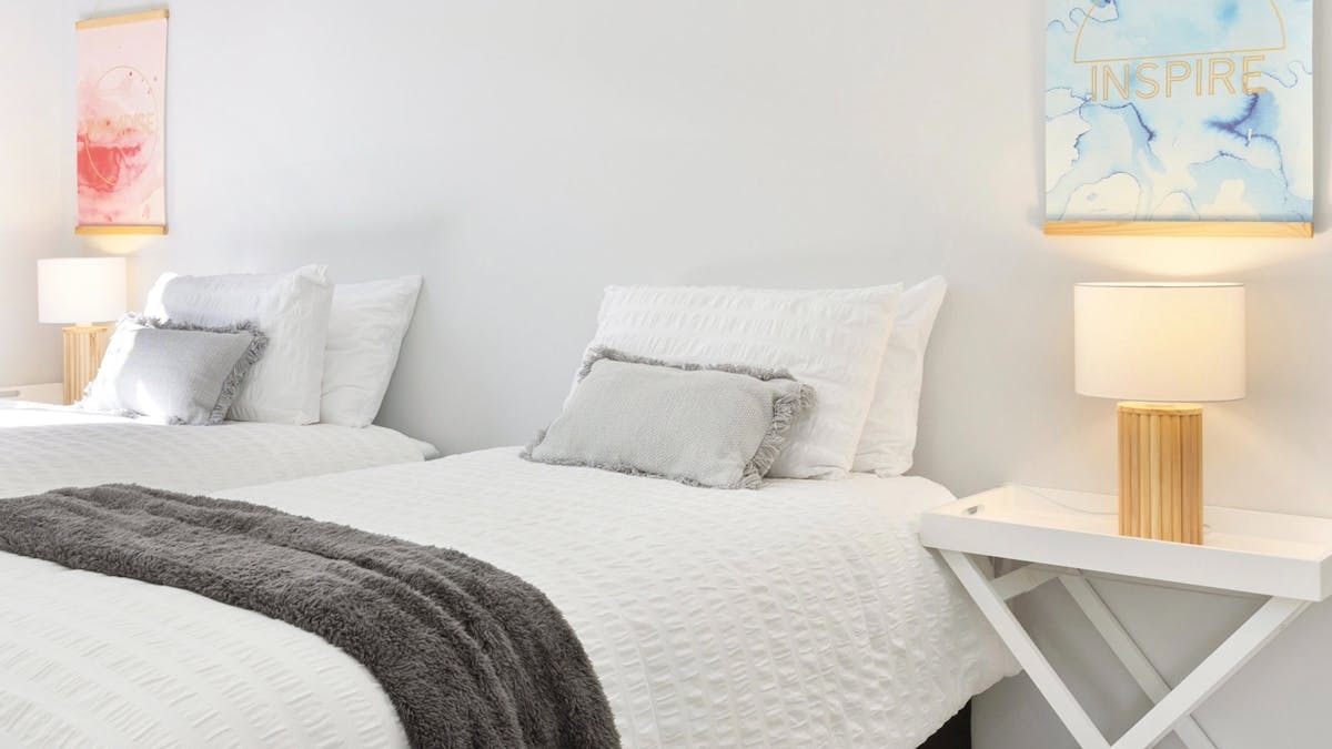 Can be setup as two singles or short king bed