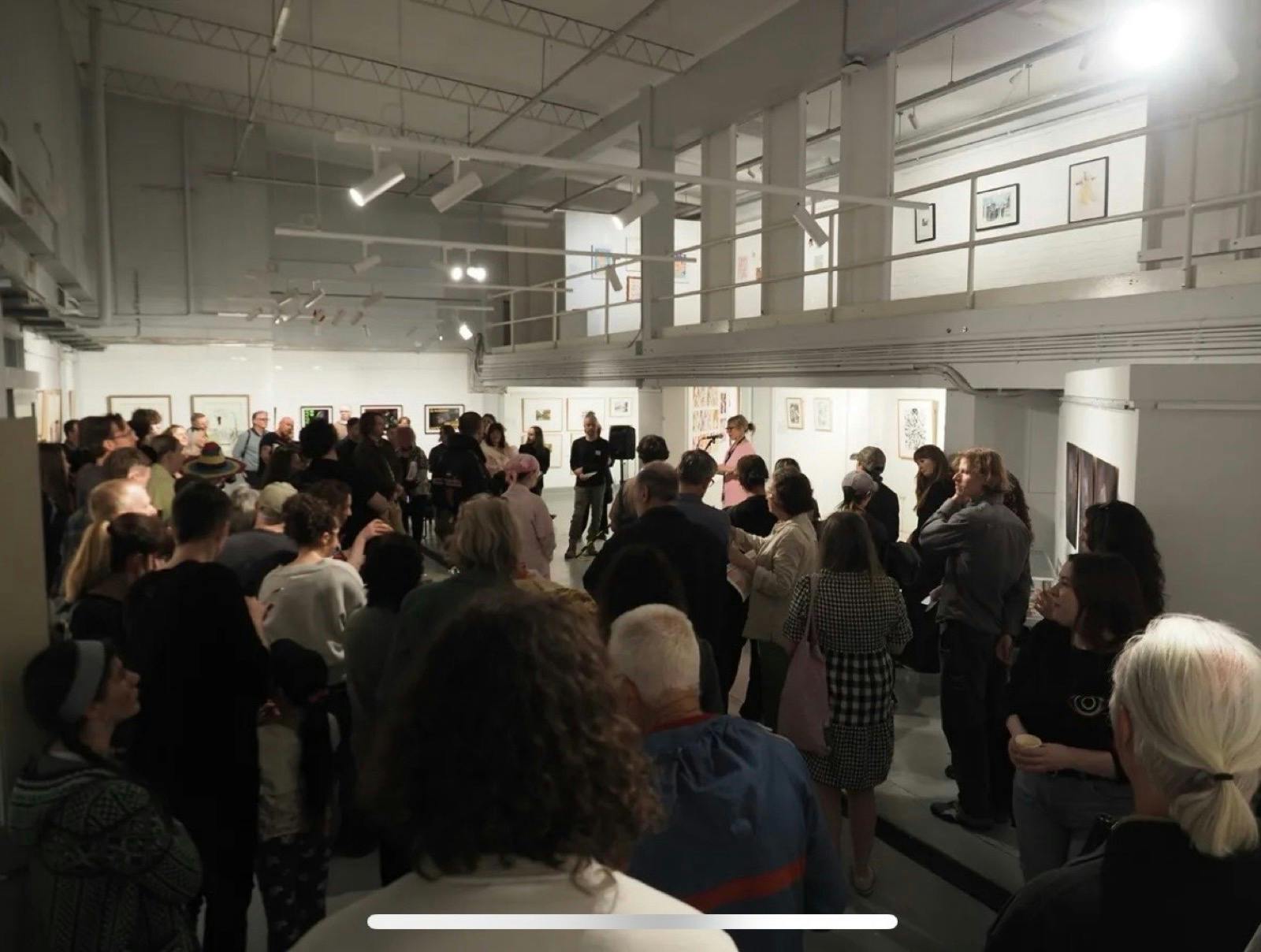 Group of people at an exhibition at the A Space Gallery