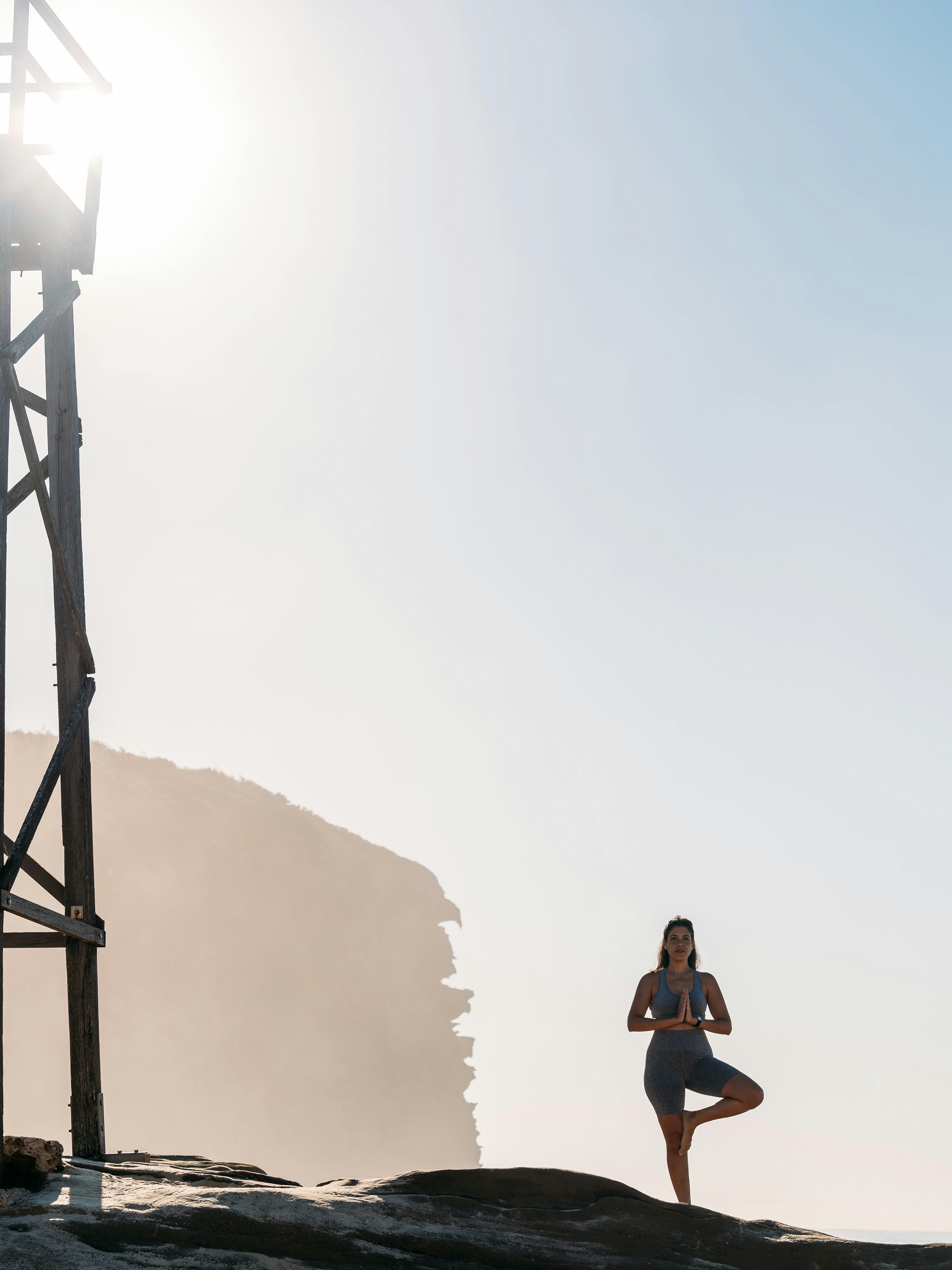 Lady enjoying sunrise yoga