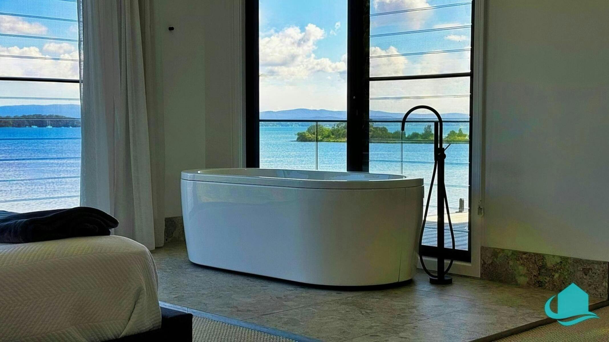 Main bedroom stand alone bath with lake views