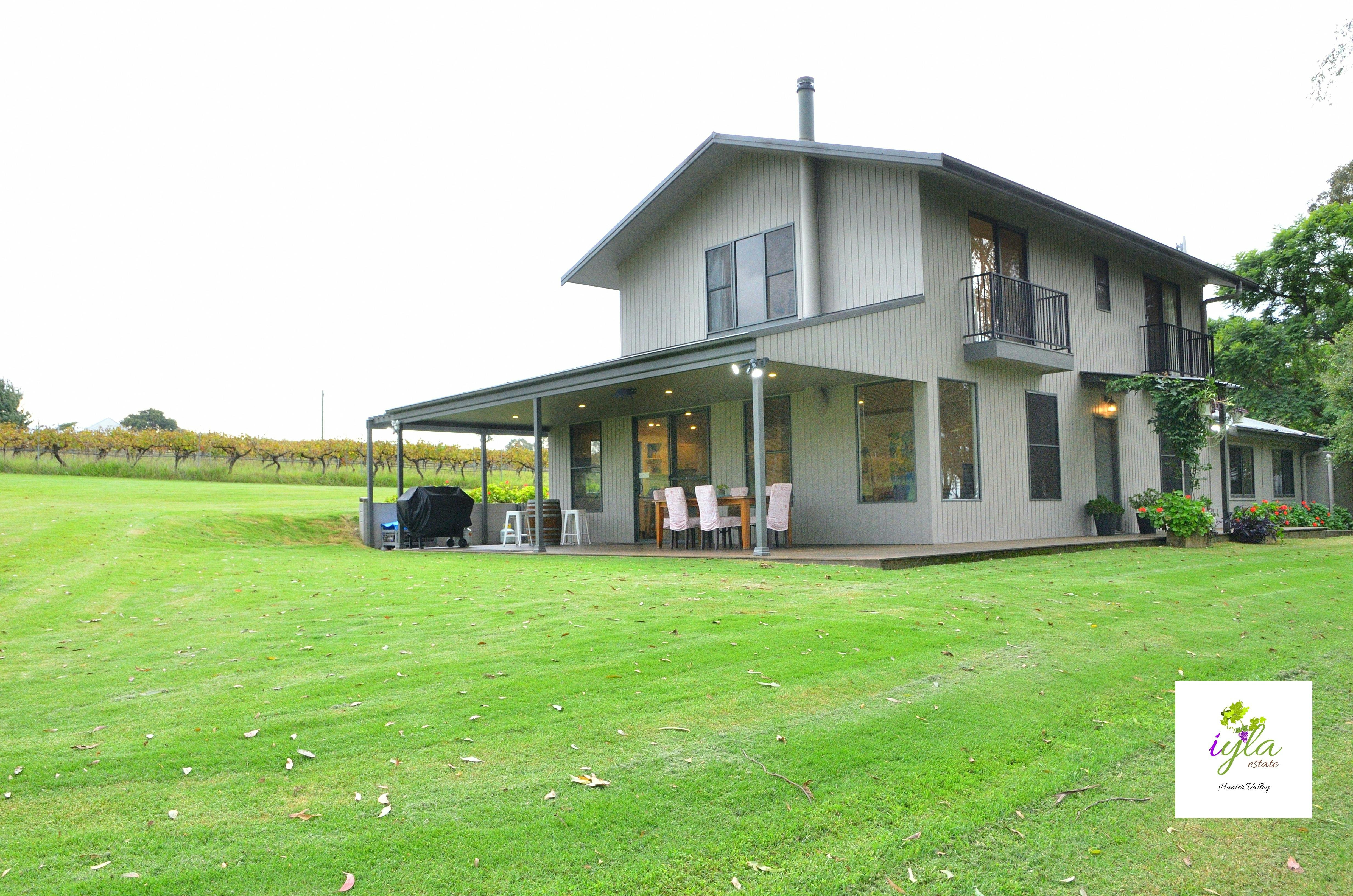 Outdoor entertaining space with views of the vines and mountains