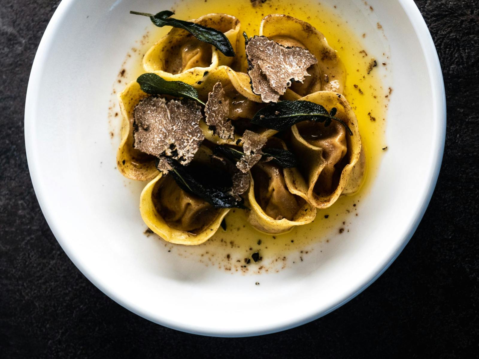 Homemade tortellini displayed with fresh truffle