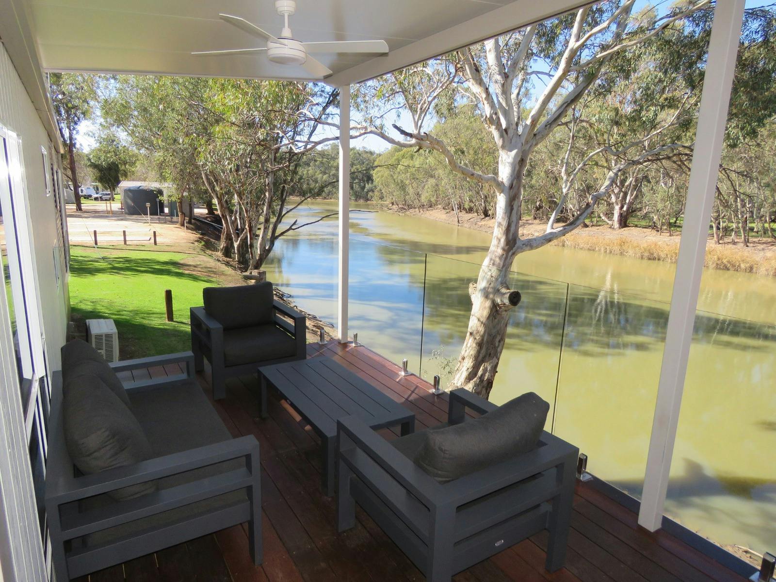 Chairs on deck of cabin looking over the river