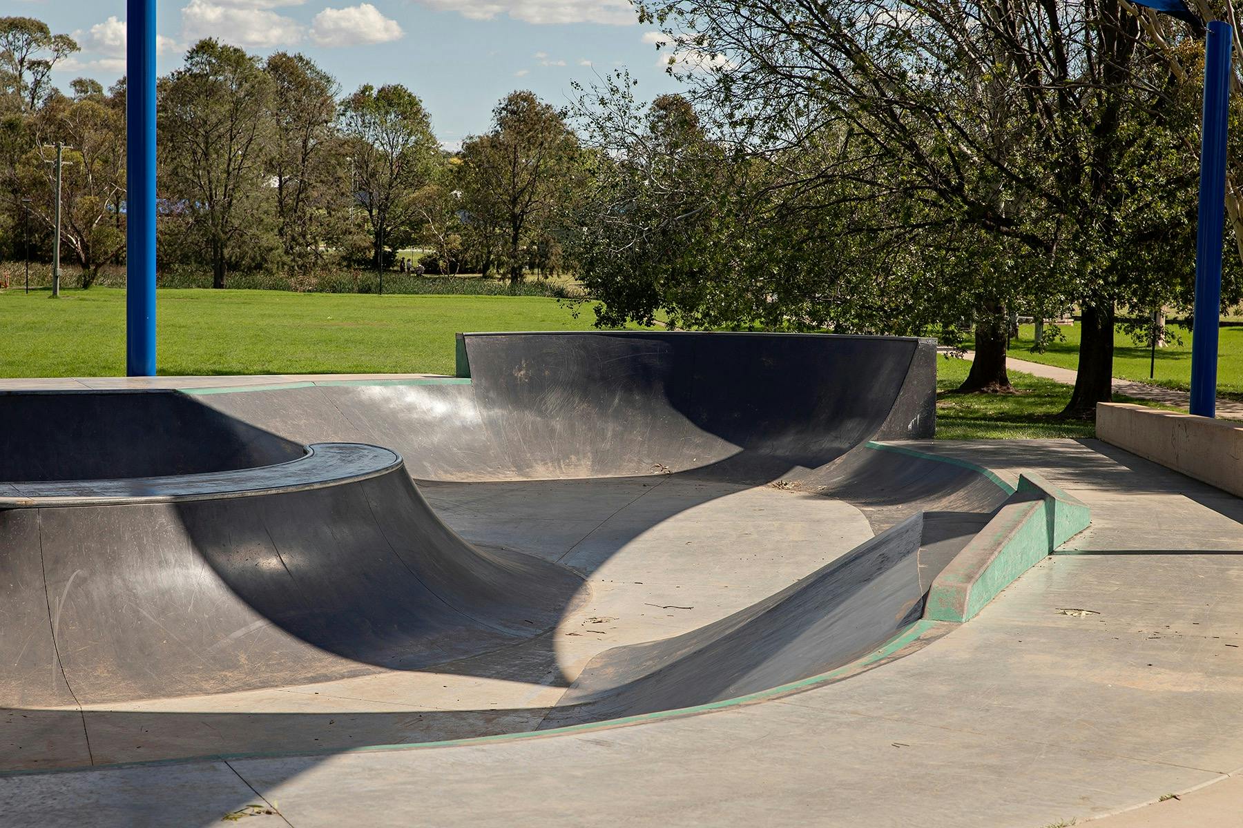 Skate park with an interesting shaped bowl which has a volcano feature as a centrepiece.