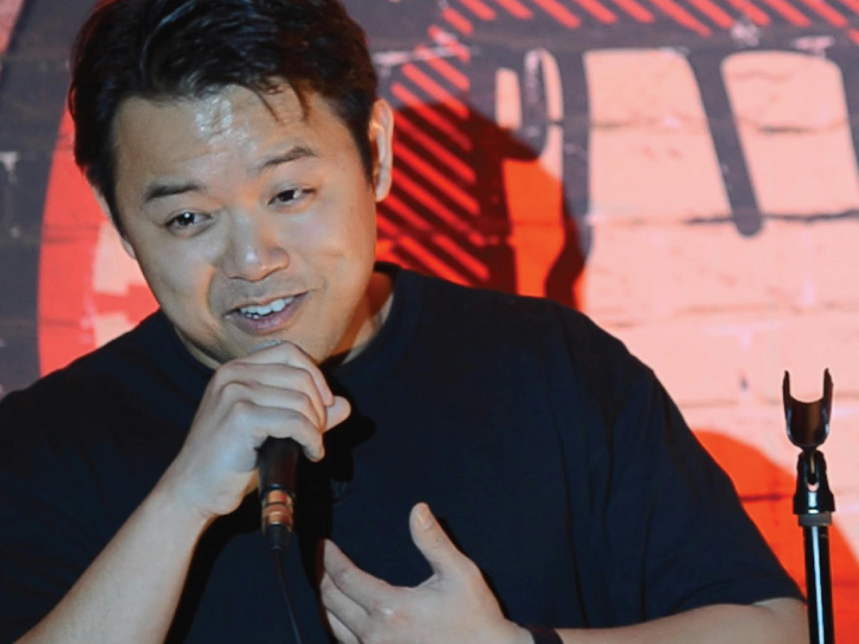 Student performing stand-up comedy