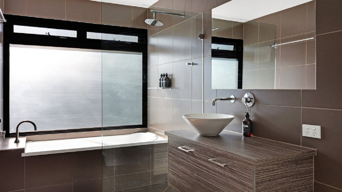 Shared bathroom with bath