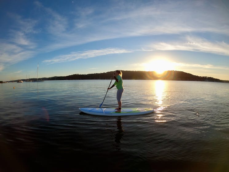 Paddle boarding at sunrise on Pittwater
