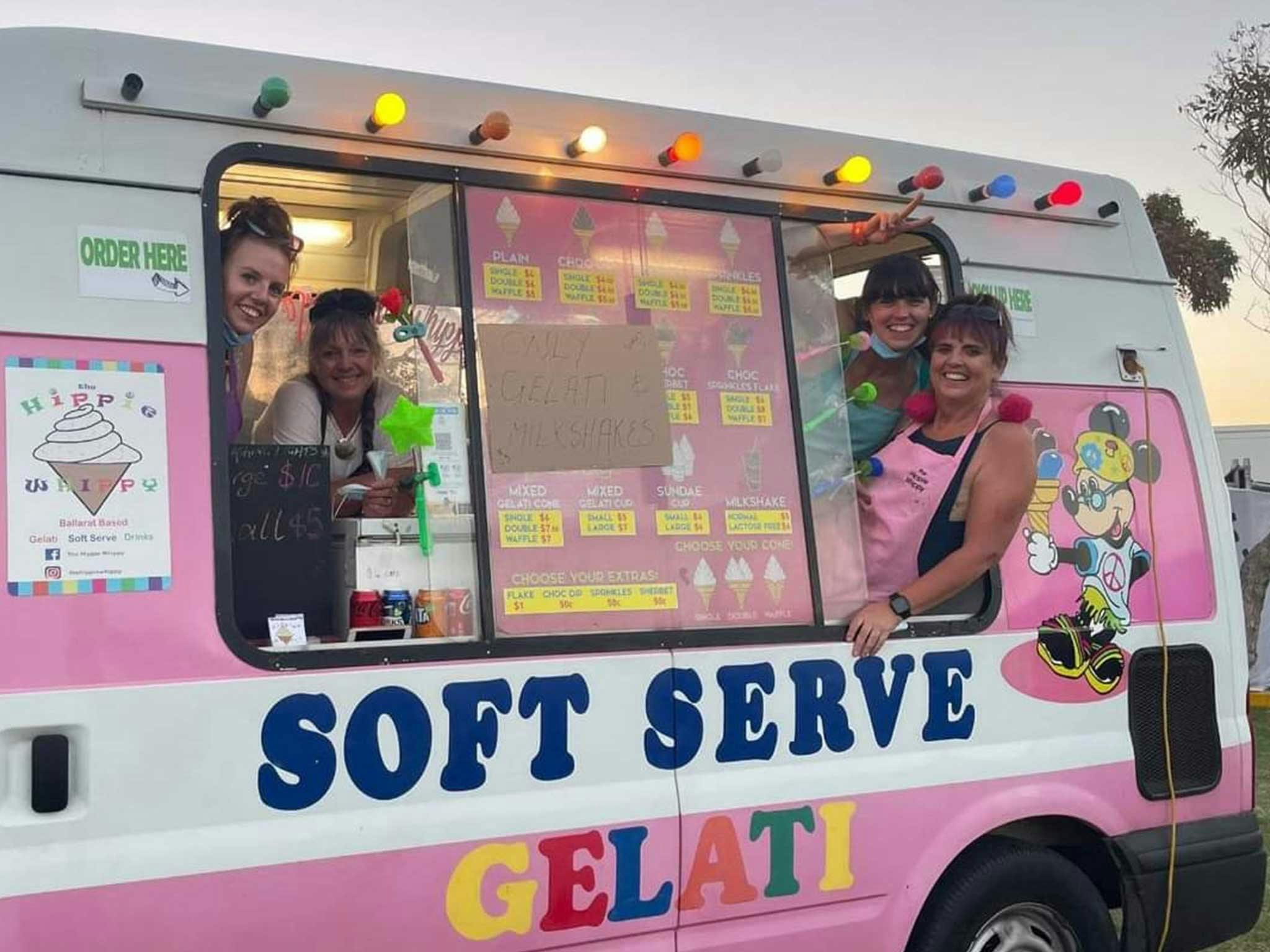 Four ladies smiling inside a ice cream van