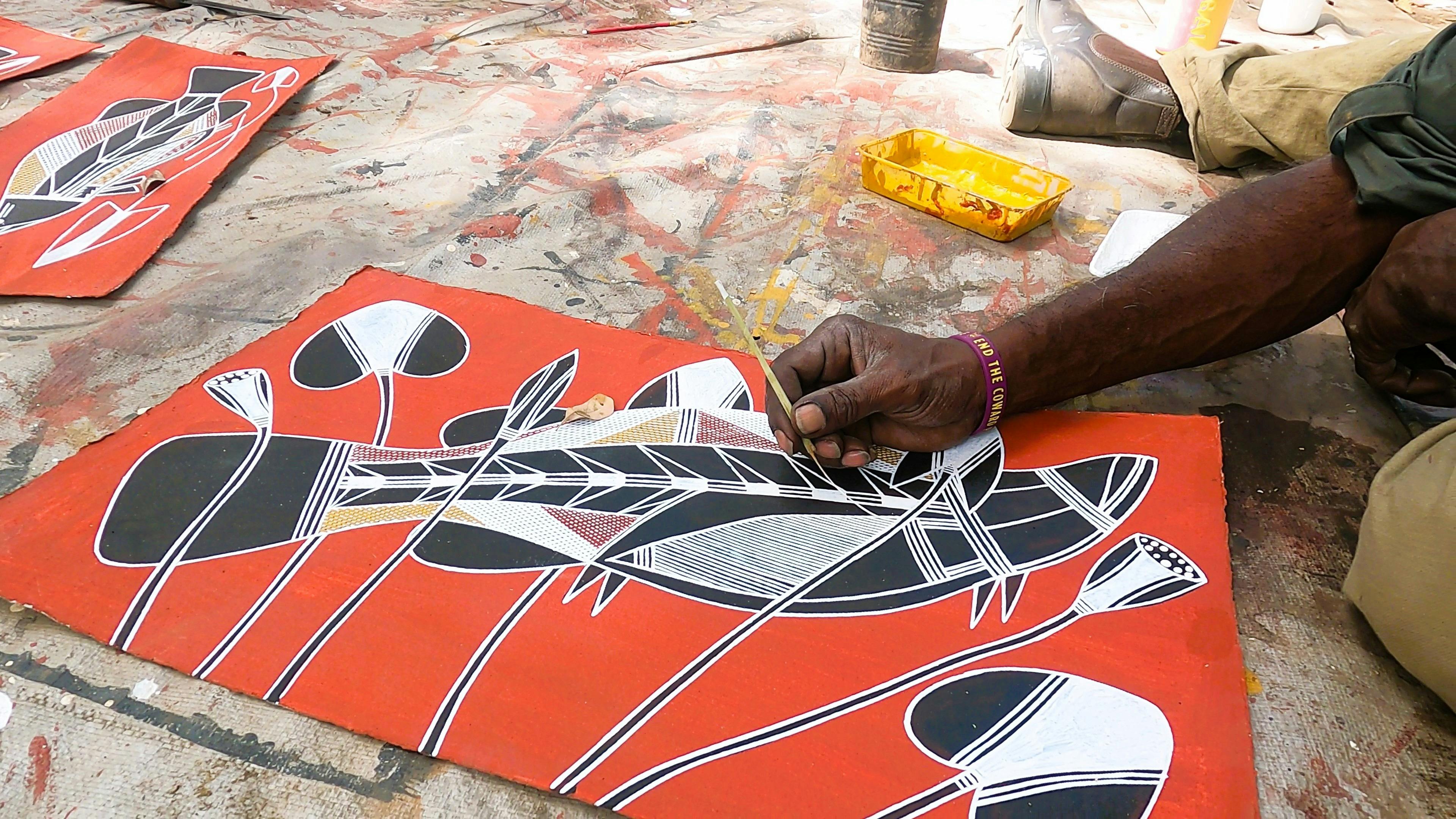 Kakadu Artist doing Rark Painting