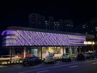 LED digital artwork facade in purple stripes by Aboriginal artist