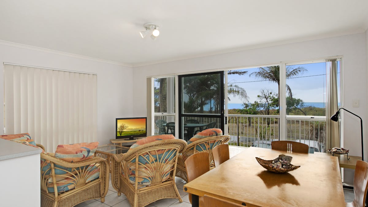 Lounge and dining area with water views