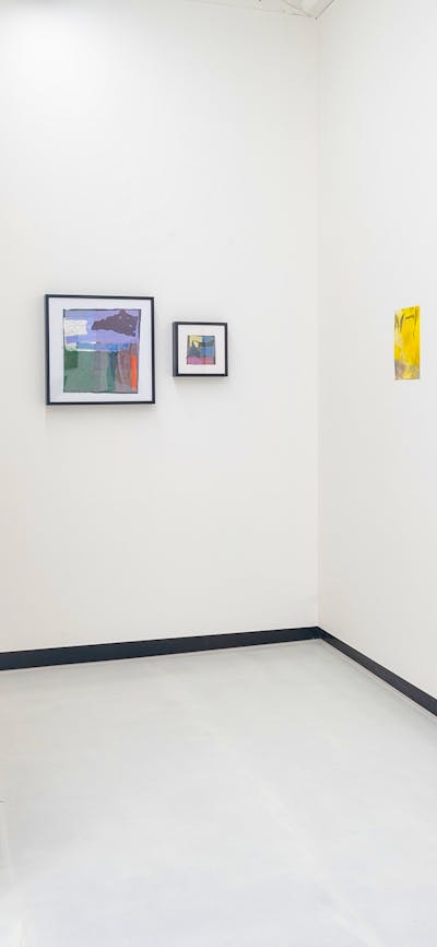 Photo of paintngs installed in gallery