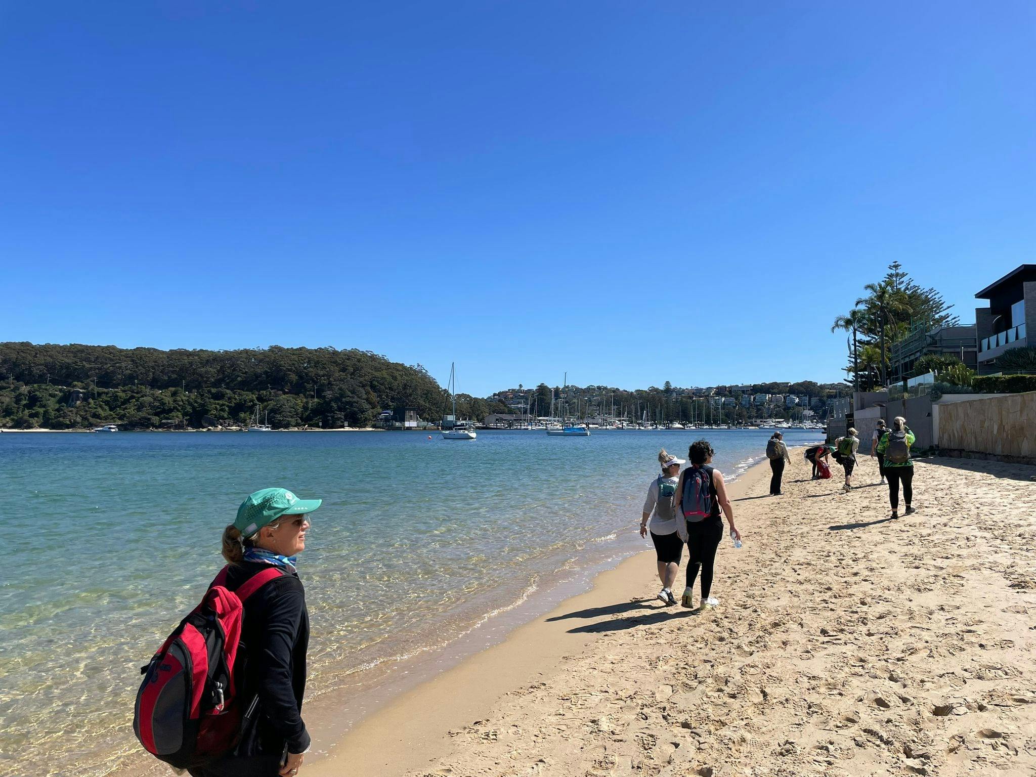 Group walking along the beach in Sydney